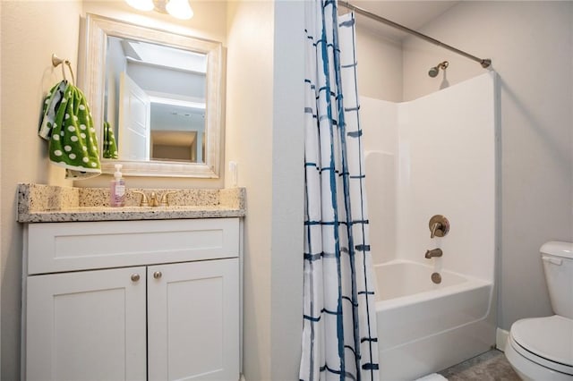 bathroom featuring vanity, toilet, and shower / bath combo with shower curtain