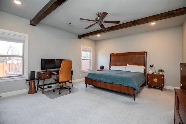 bedroom featuring carpet, visible vents, and beam ceiling