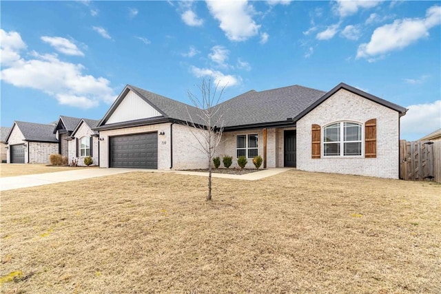 view of front of property with a garage, a front lawn, concrete driveway, and brick siding