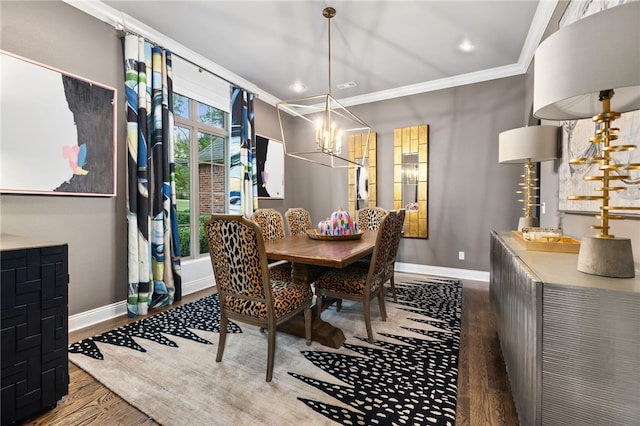 dining room featuring an inviting chandelier, baseboards, ornamental molding, and wood finished floors