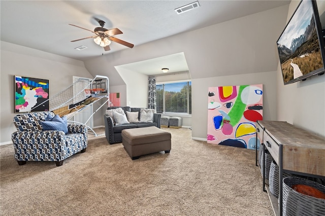 recreation room with carpet floors, baseboards, visible vents, and a ceiling fan