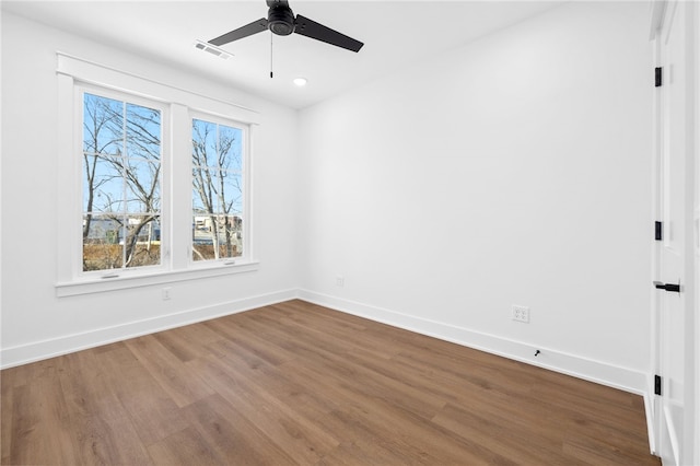 unfurnished bedroom featuring recessed lighting, visible vents, ceiling fan, wood finished floors, and baseboards