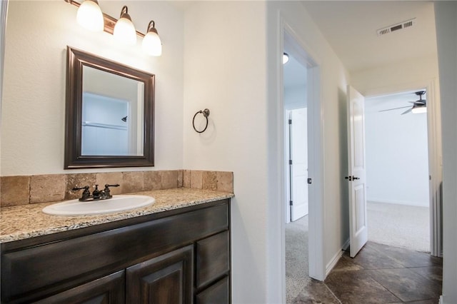 bathroom featuring visible vents and vanity