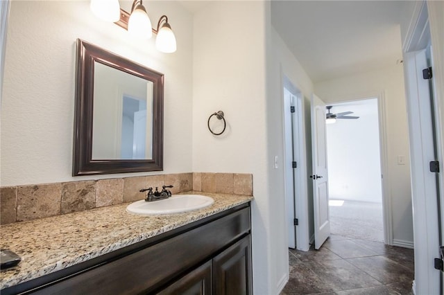 bathroom featuring vanity and baseboards