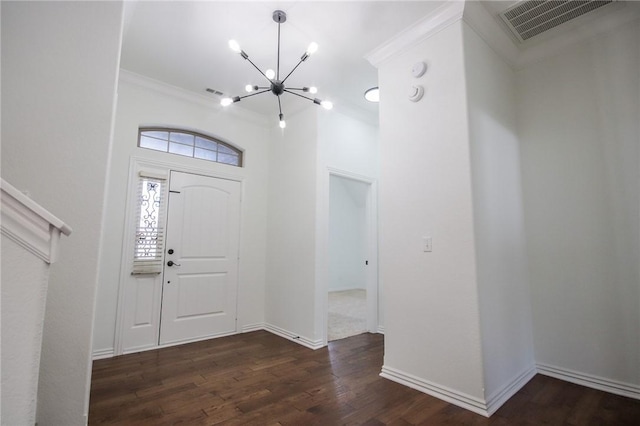 entrance foyer with baseboards, visible vents, dark wood-style floors, crown molding, and a chandelier