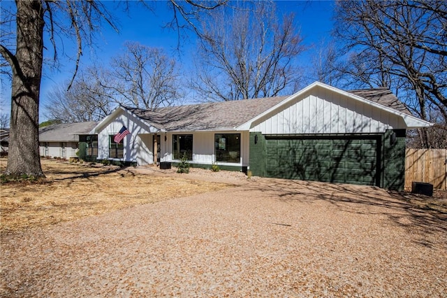 view of front facade with driveway, an attached garage, and brick siding