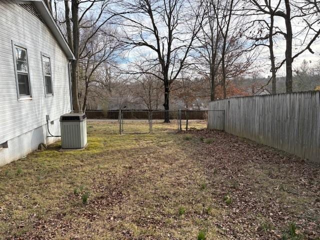 view of yard with a fenced backyard and cooling unit