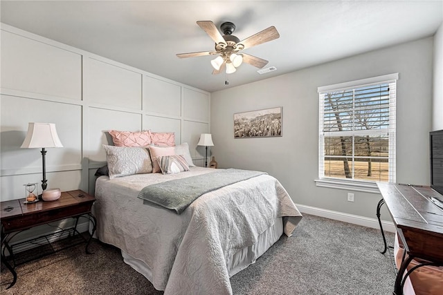 carpeted bedroom with ceiling fan, visible vents, and baseboards