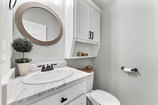 half bath with vanity and toilet