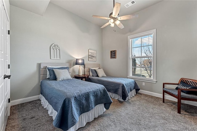 carpeted bedroom with a ceiling fan, visible vents, and baseboards