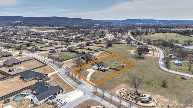 drone / aerial view featuring a residential view and a mountain view