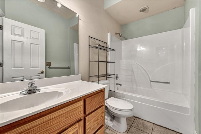 full bathroom featuring toilet, tile patterned floors, tub / shower combination, and vanity