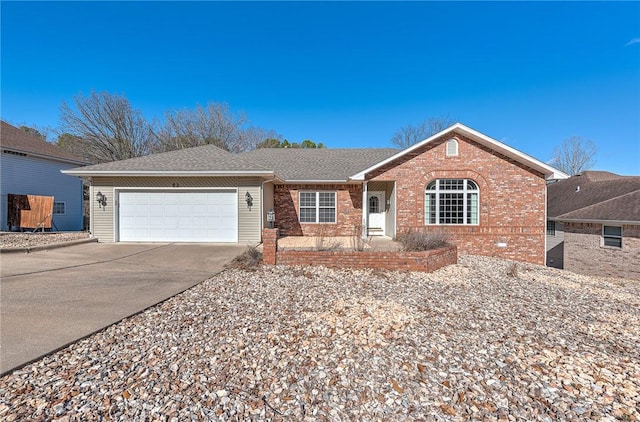 single story home with driveway, brick siding, an attached garage, and a shingled roof