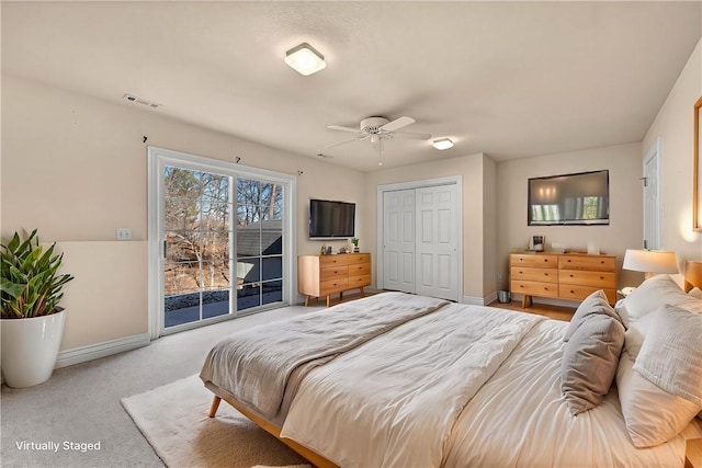 bedroom with baseboards, visible vents, access to exterior, carpet flooring, and a closet