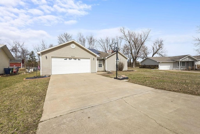 ranch-style house featuring an attached garage, driveway, and a front yard