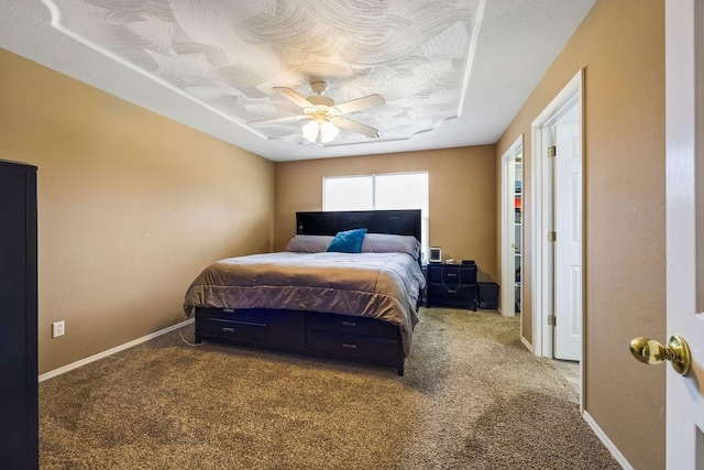 bedroom featuring carpet floors, ceiling fan, and baseboards