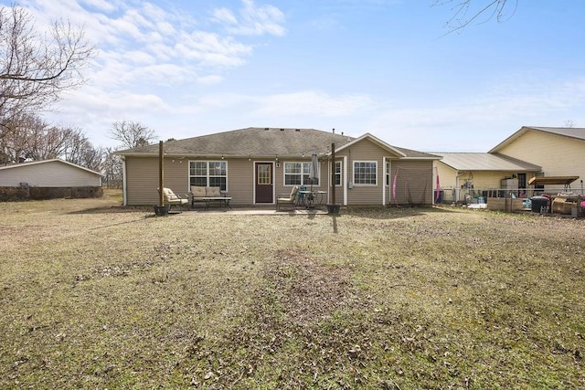 back of house with a patio and fence