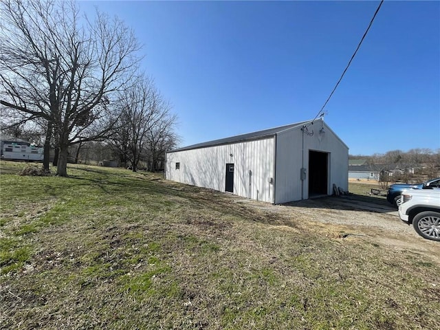 view of pole building with a lawn