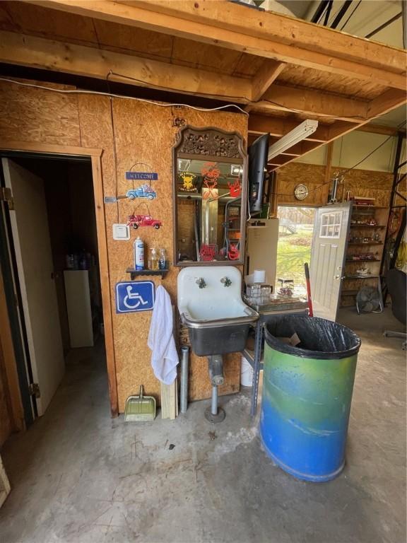 utility room featuring water heater