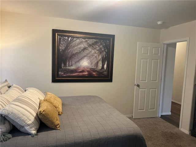 carpeted bedroom with baseboards