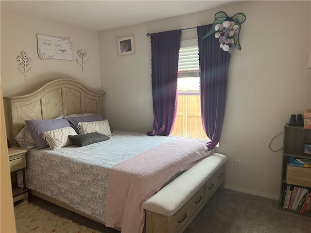 carpeted bedroom featuring baseboards