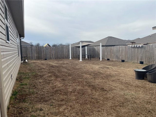 view of yard featuring a fenced backyard