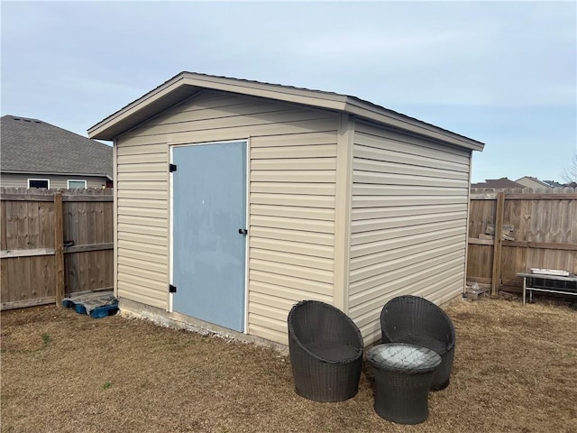 view of shed featuring a fenced backyard