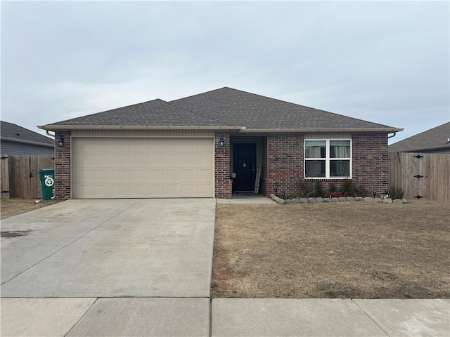 ranch-style house featuring brick siding, roof with shingles, concrete driveway, fence, and a garage