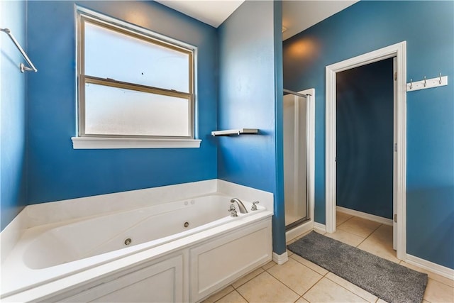 full bathroom featuring tile patterned flooring, a shower stall, baseboards, and a whirlpool tub