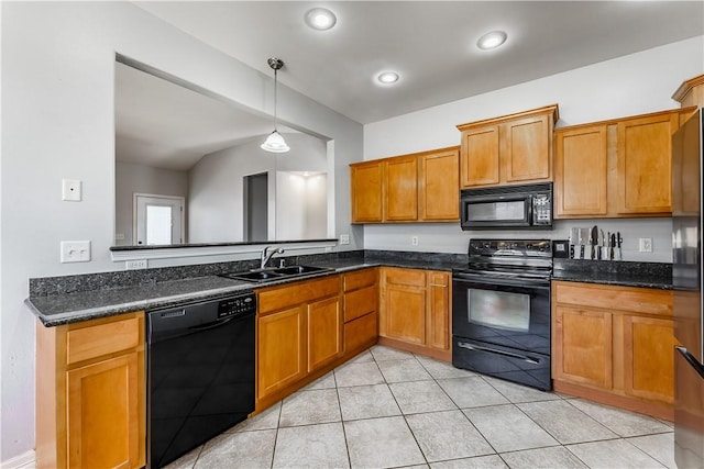 kitchen featuring decorative light fixtures, brown cabinets, black appliances, and a sink