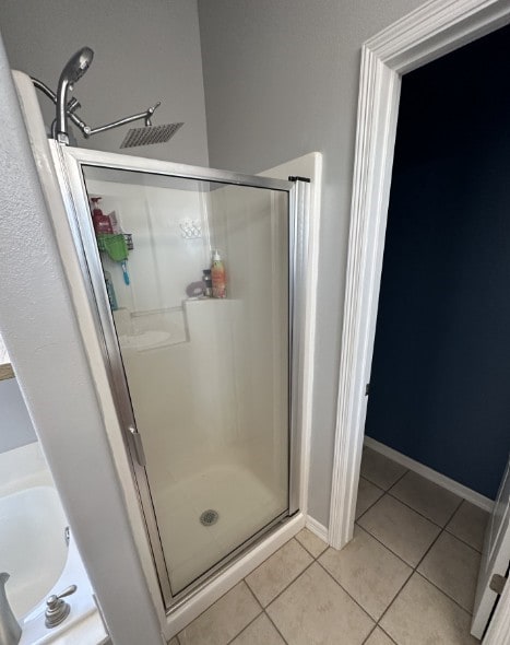 760 Napa Ave, Centerton, AR 72719 - bathroom featuring a shower stall, tile patterned flooring, and baseboards