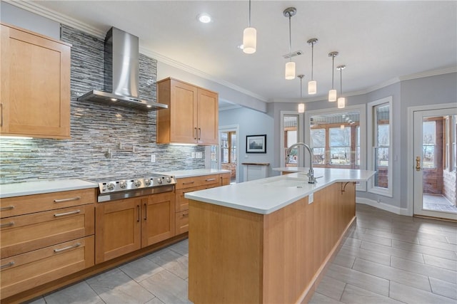 kitchen featuring light countertops, visible vents, stainless steel gas stovetop, decorative backsplash, and wall chimney exhaust hood