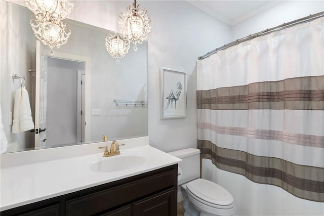 bathroom featuring toilet, an inviting chandelier, crown molding, and vanity