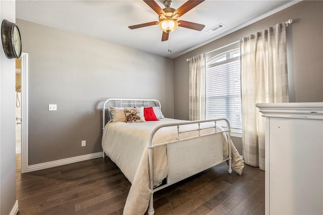 bedroom featuring a ceiling fan, baseboards, visible vents, and dark wood-style flooring