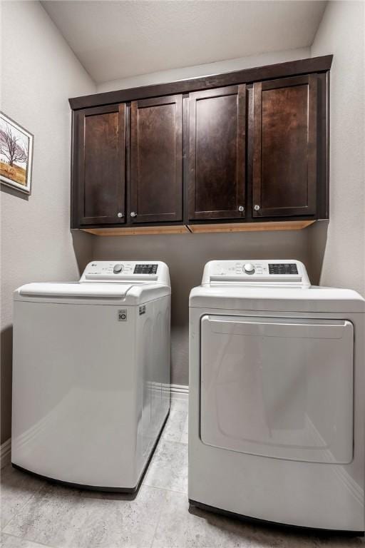 laundry area featuring cabinet space and washer and dryer