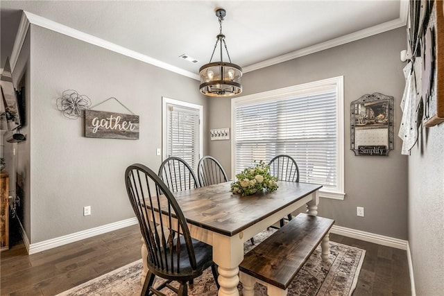 dining space with dark wood-style floors, ornamental molding, visible vents, and baseboards