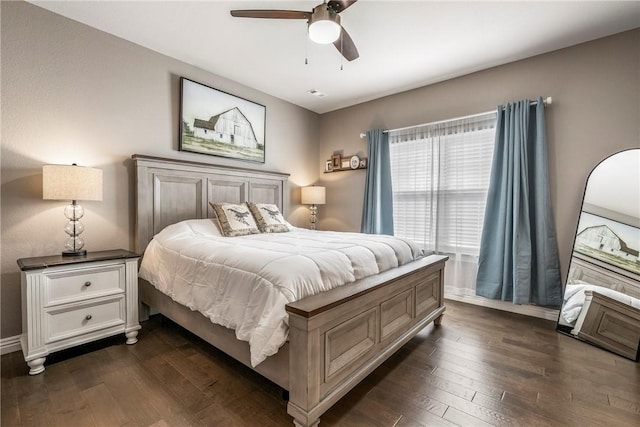 bedroom featuring ceiling fan and dark wood-type flooring