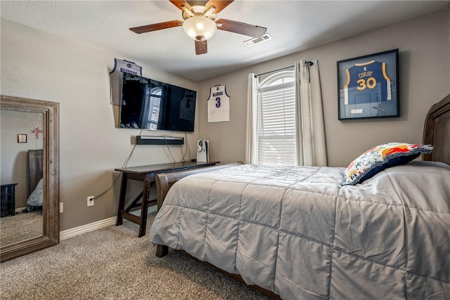 bedroom featuring carpet floors, baseboards, visible vents, and ceiling fan