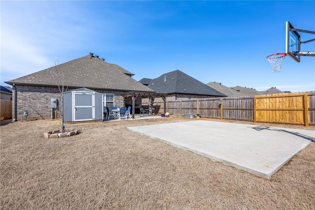 exterior space featuring a fenced backyard, a storage shed, and a pergola