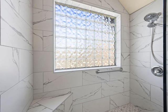 full bath featuring tiled shower