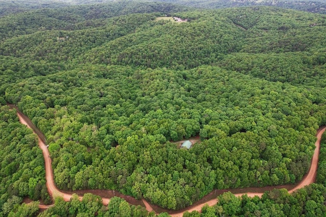 aerial view featuring a wooded view