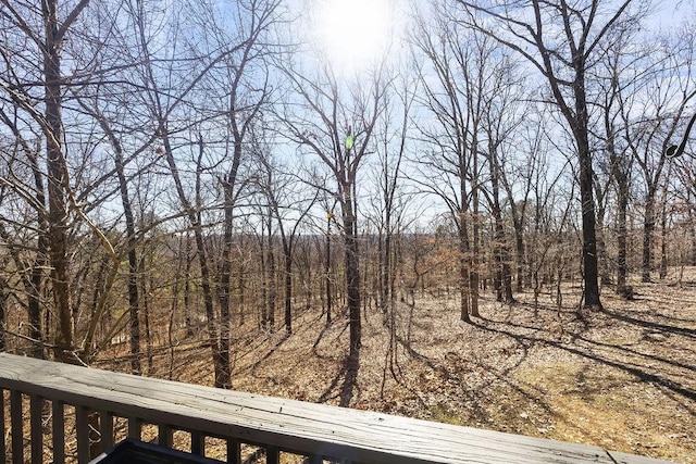 exterior space with a wooded view