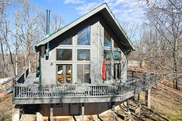 rear view of house featuring a deck