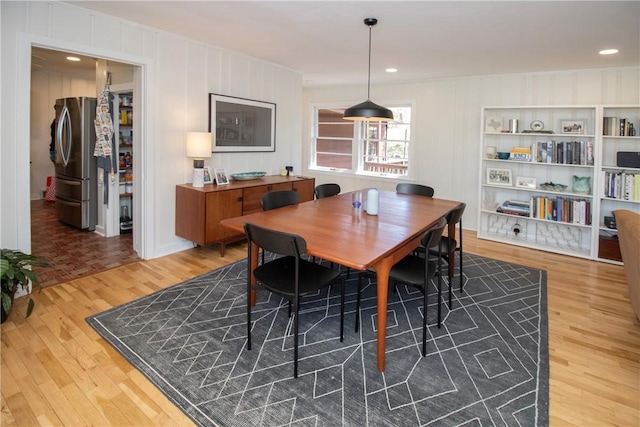 dining area featuring recessed lighting and wood finished floors