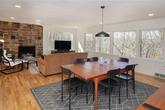 dining space featuring plenty of natural light, wood finished floors, and visible vents