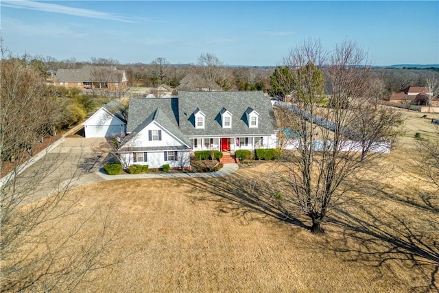 cape cod home with covered porch