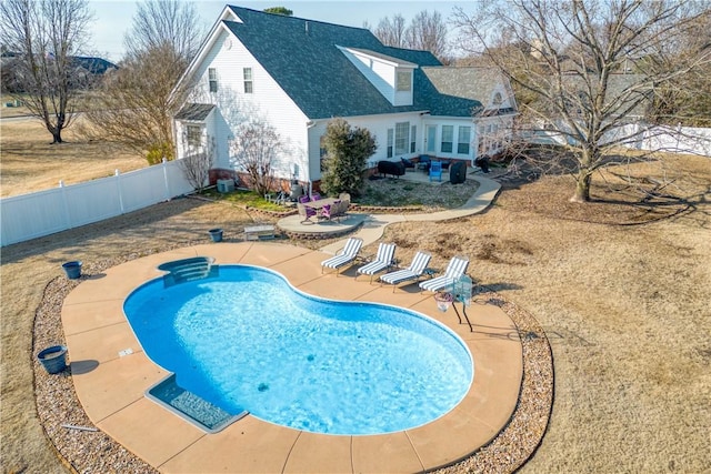 view of swimming pool with a patio area, a fenced backyard, and a fenced in pool