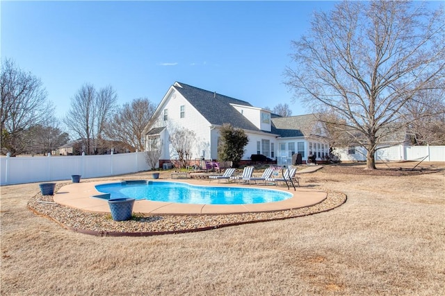 view of swimming pool with a fenced in pool, a patio area, a yard, and a fenced backyard