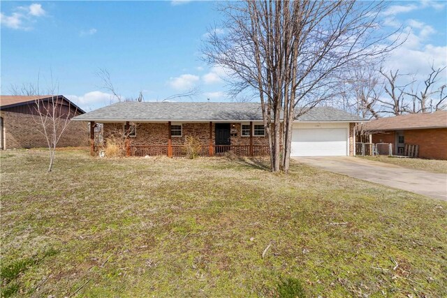 single story home with driveway, a porch, a front yard, a garage, and brick siding