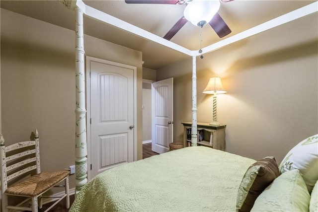 bedroom featuring a ceiling fan and baseboards